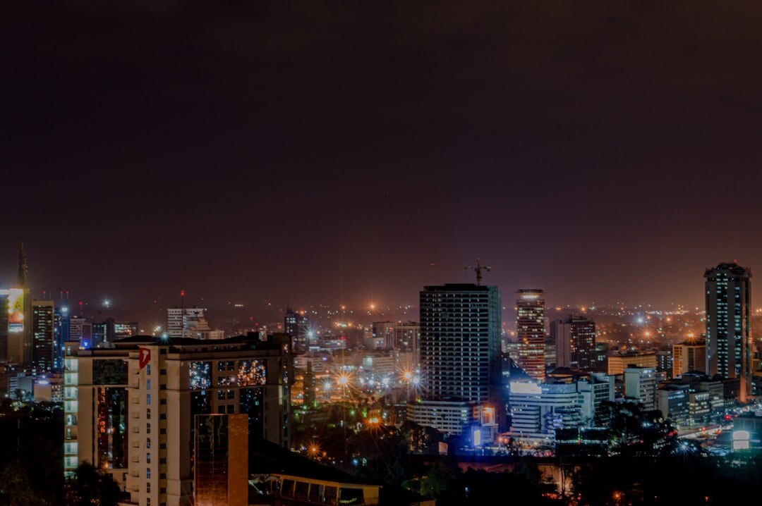 City skyline at dusk with warm lights