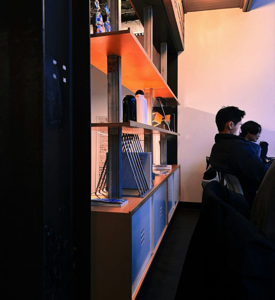 Small newsroom team meeting around a table